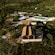 A building with a tennis court surrounded by the lush Croatian countryside